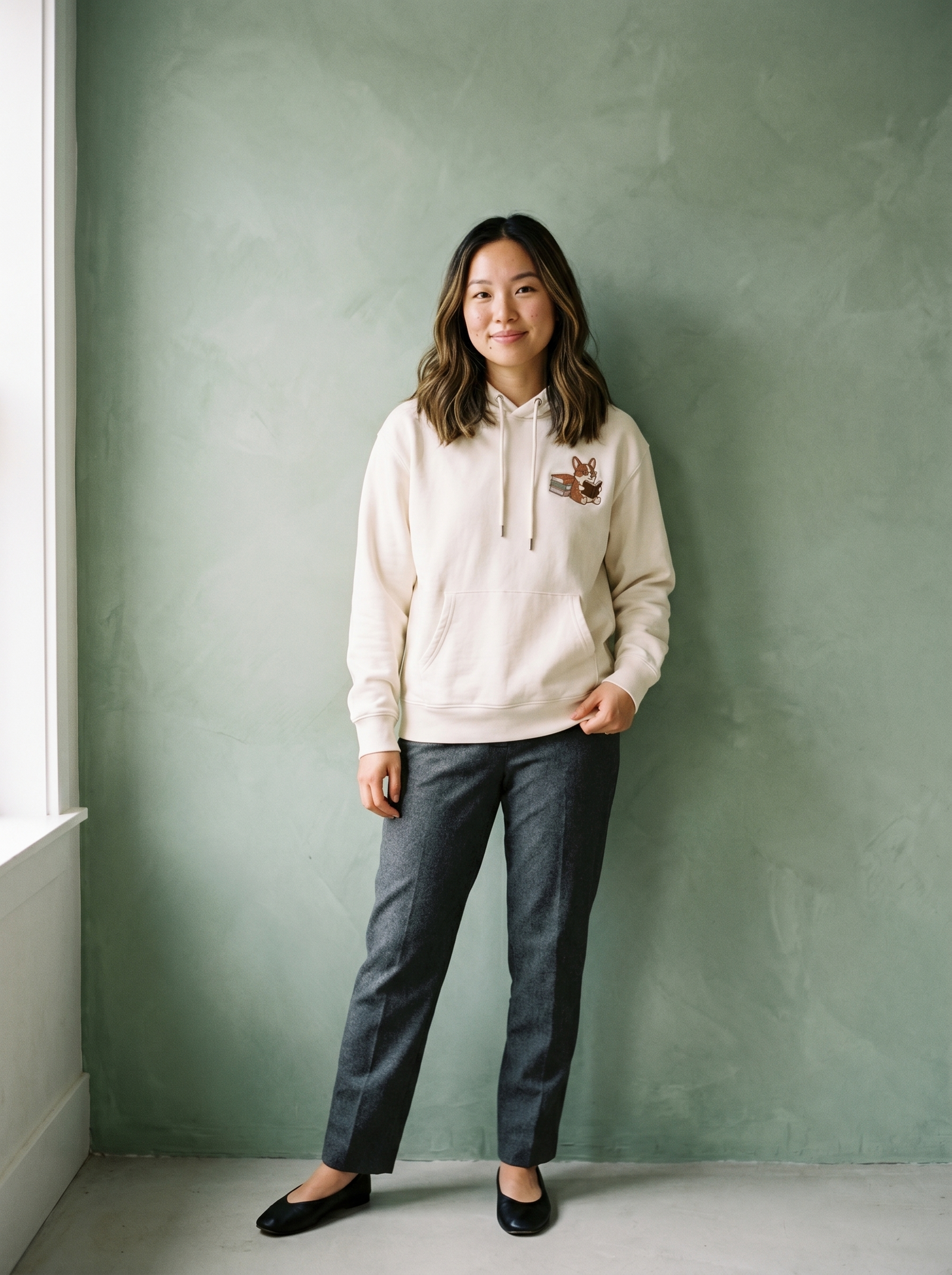 embroidered bookstore corgi hoodie - model standing