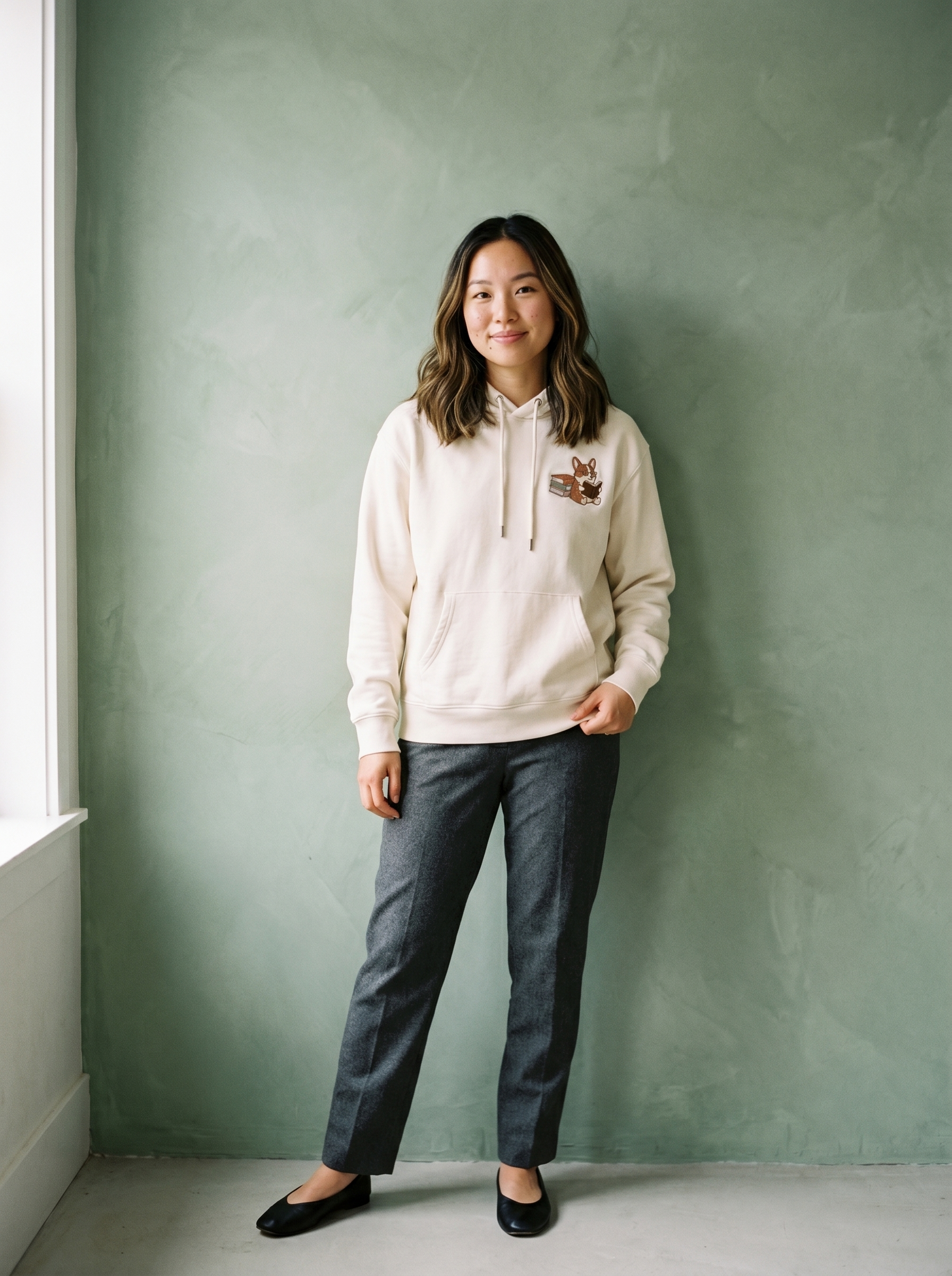 embroidered bookstore corgi hoodie - model standing