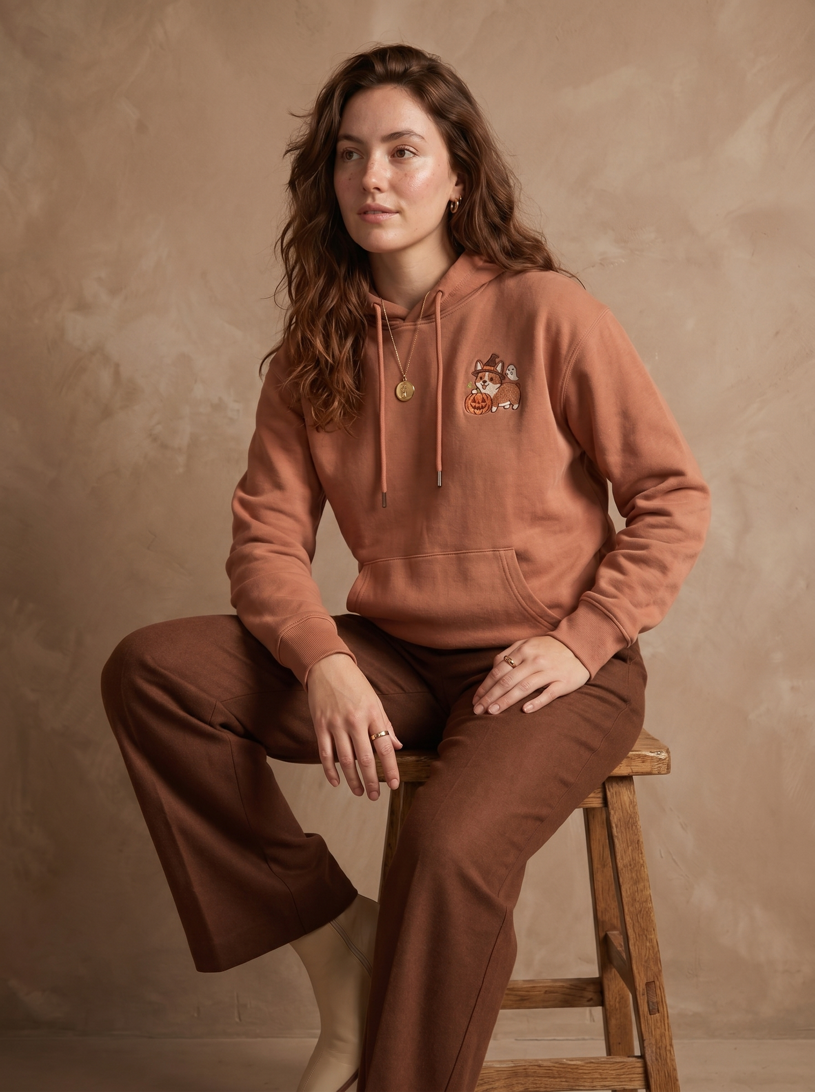 embroidered halloween corgi hoodie - model seated