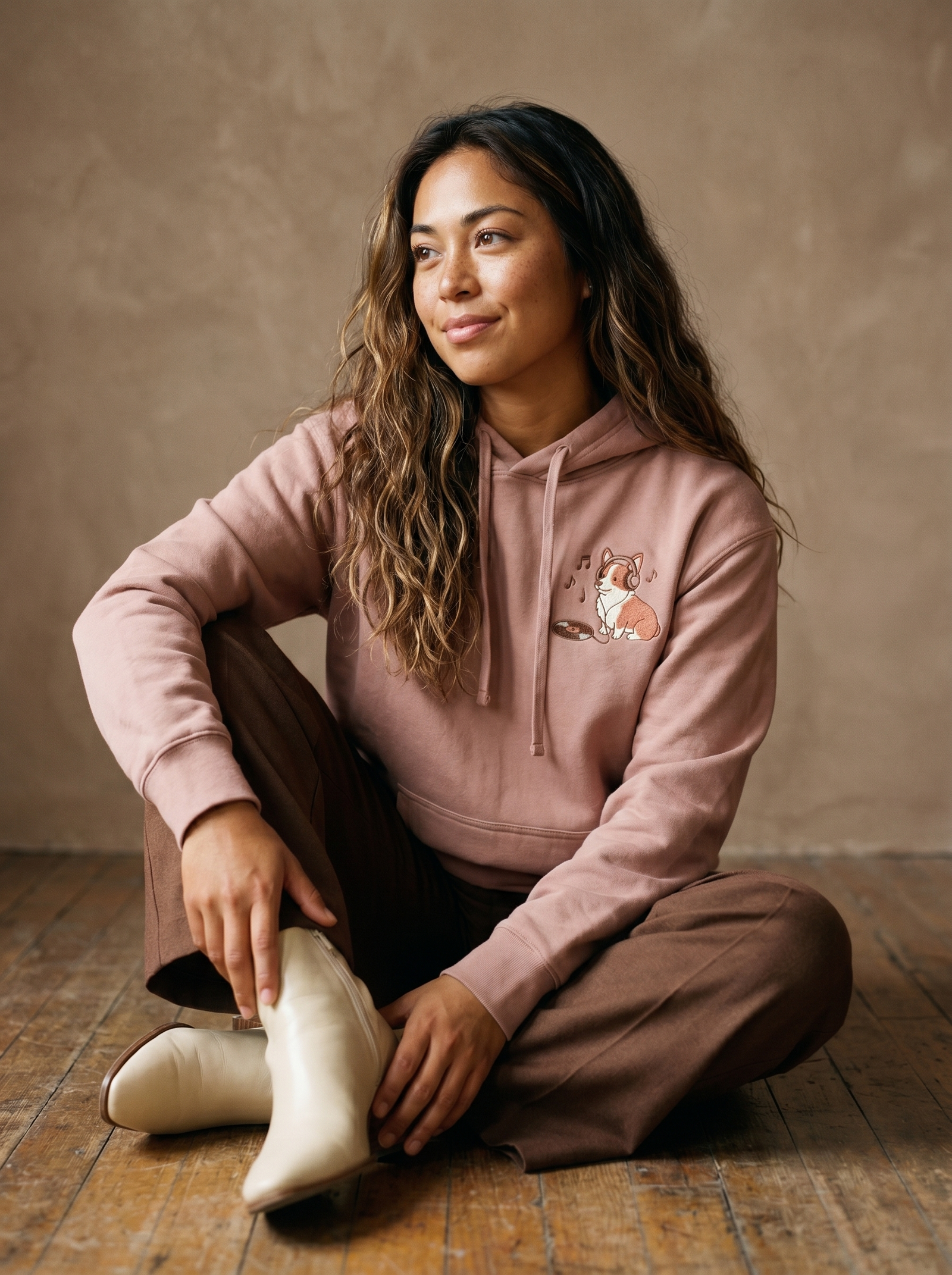 embroidered vinyl corgi hoodie - model seated
