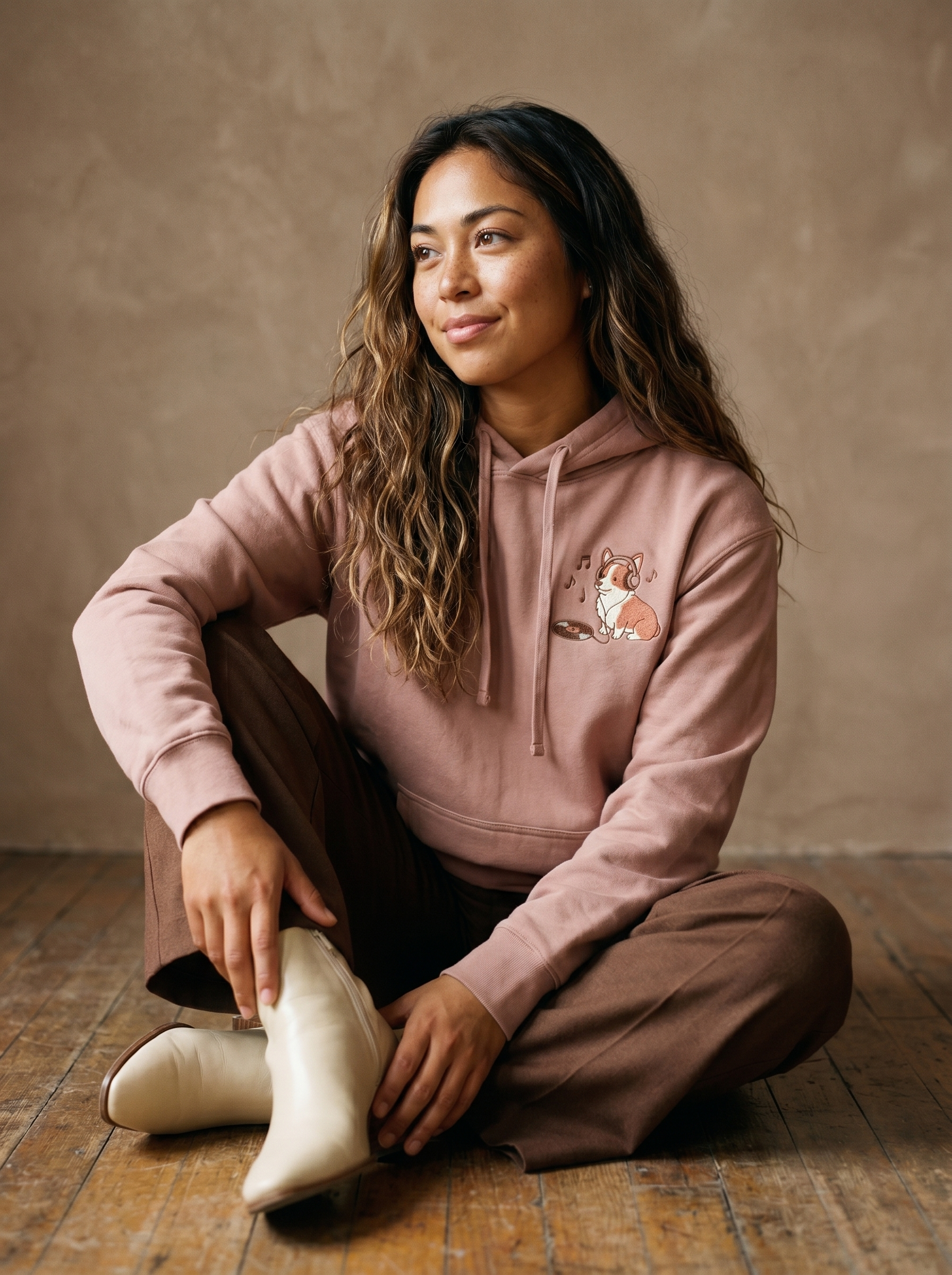 embroidered vinyl corgi hoodie - model seated