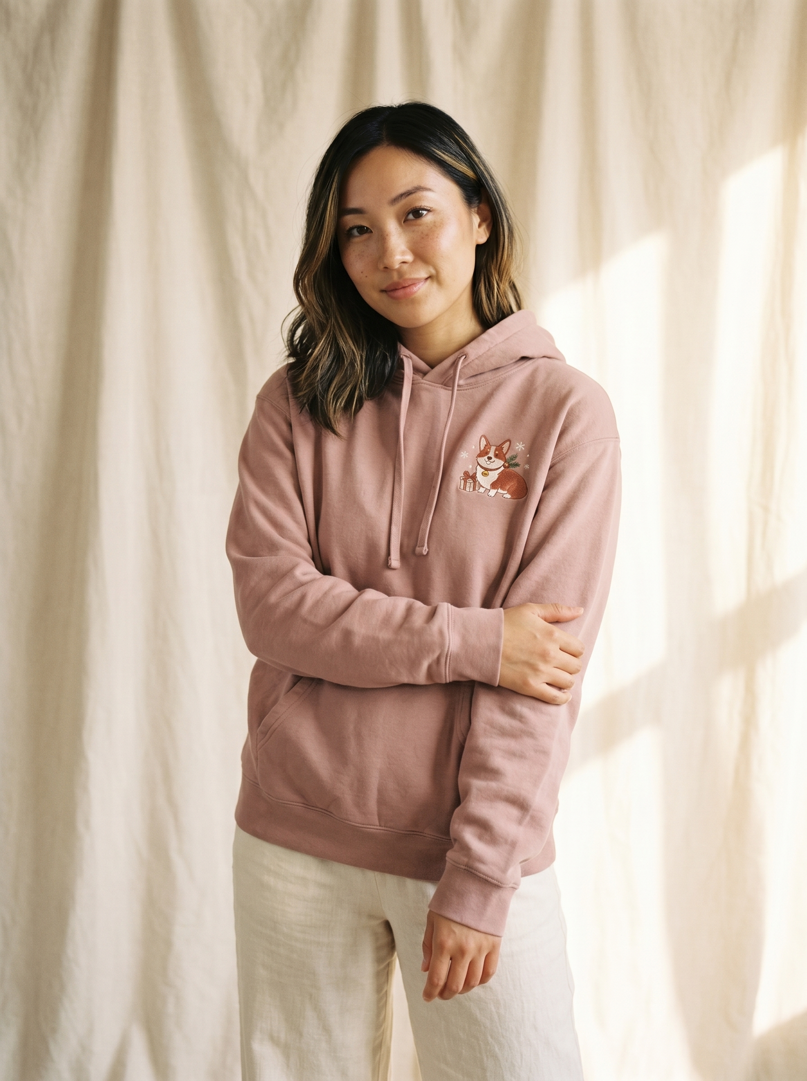 embroidered christmas corgi hoodie - model standing